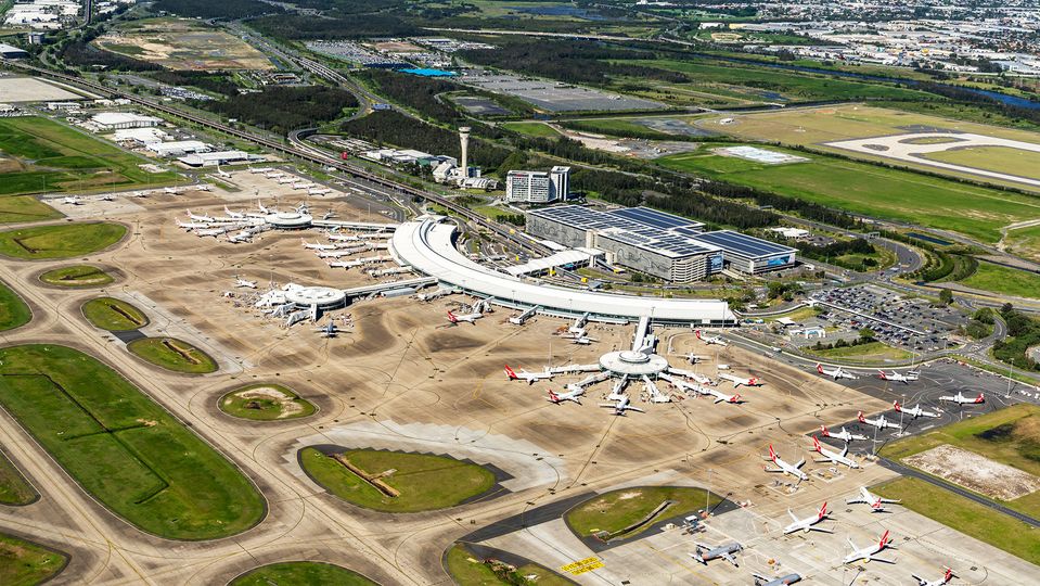 An aerial view of Brisbane Domestic Airport, including its rooftop solar panels.